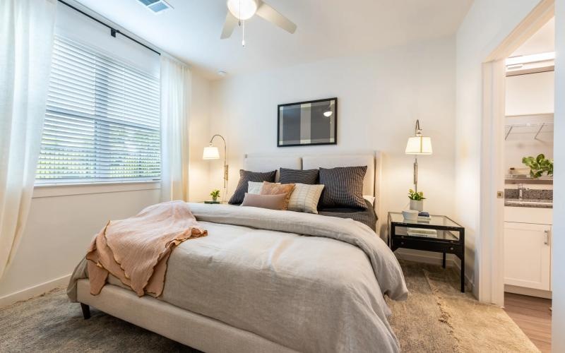 a bedroom with a bed and a tv