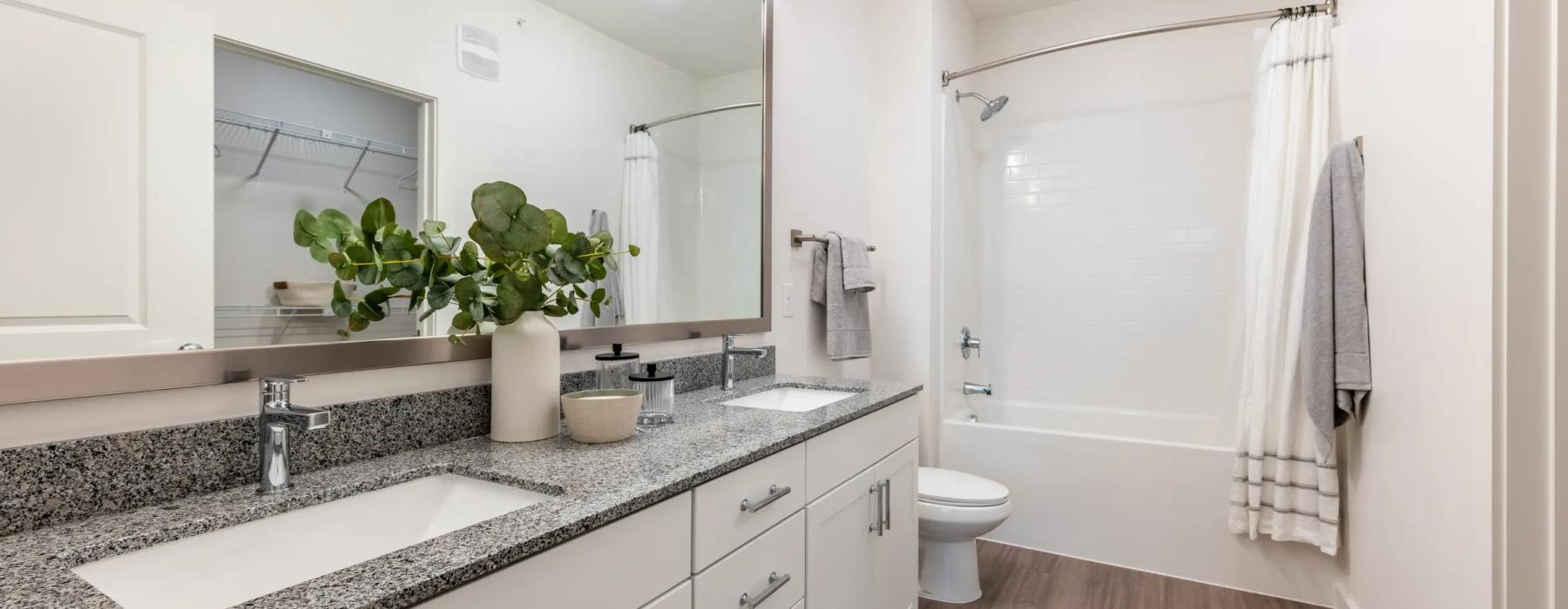 a bathroom with a tub sink and toilet