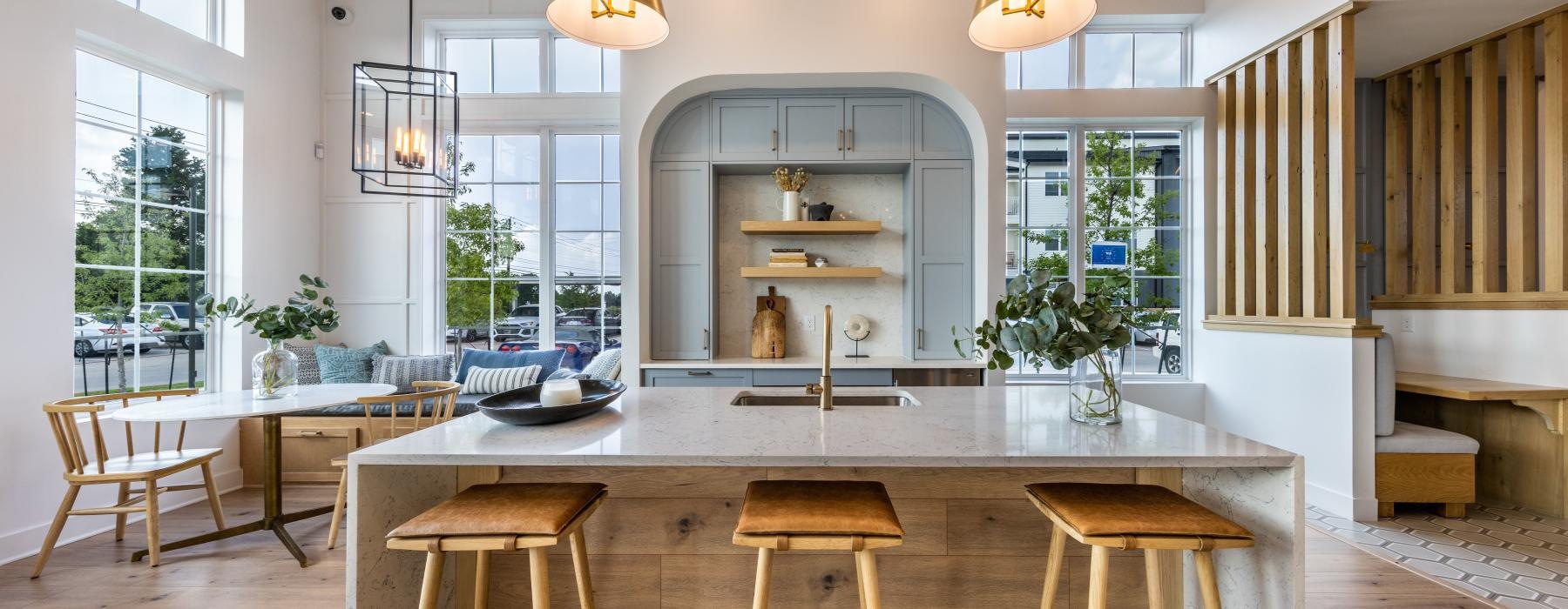 a kitchen with a bar and stools