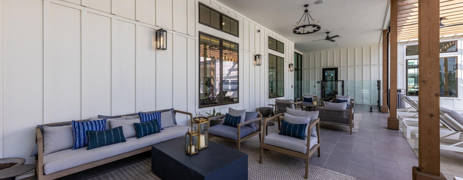 a living room with a couch and chairs