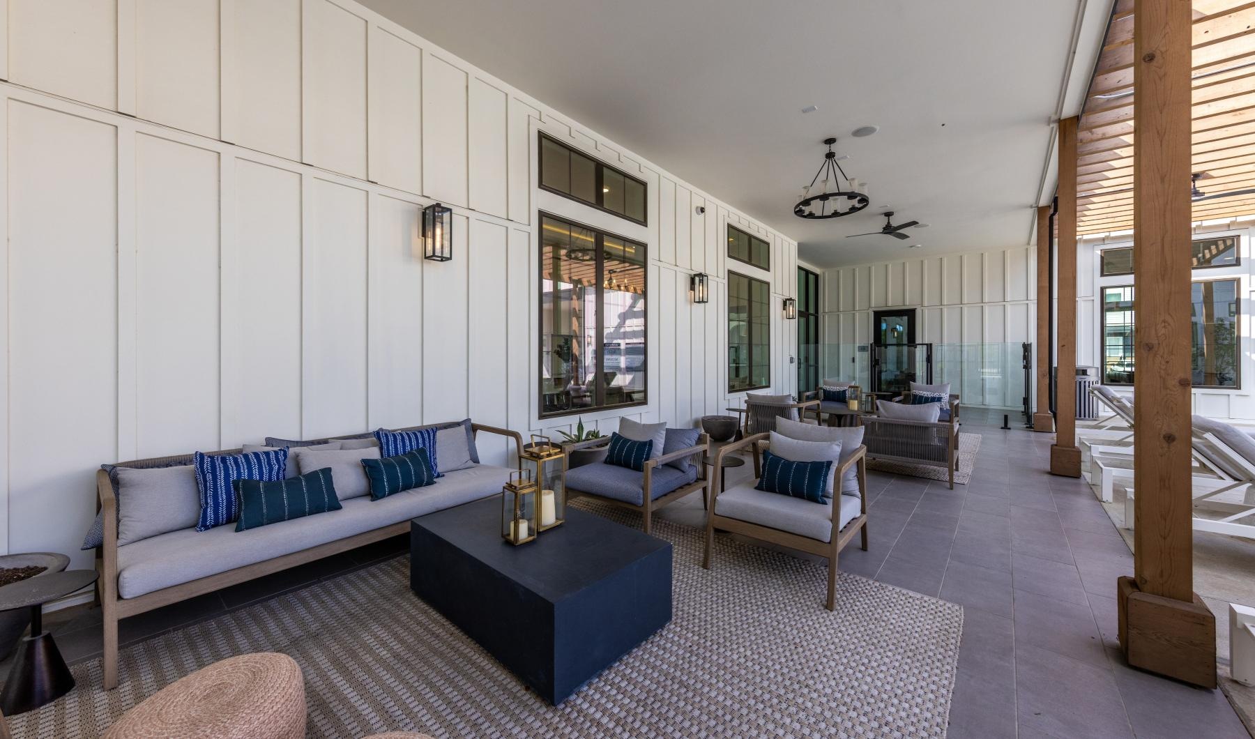 a living room with a couch and chairs